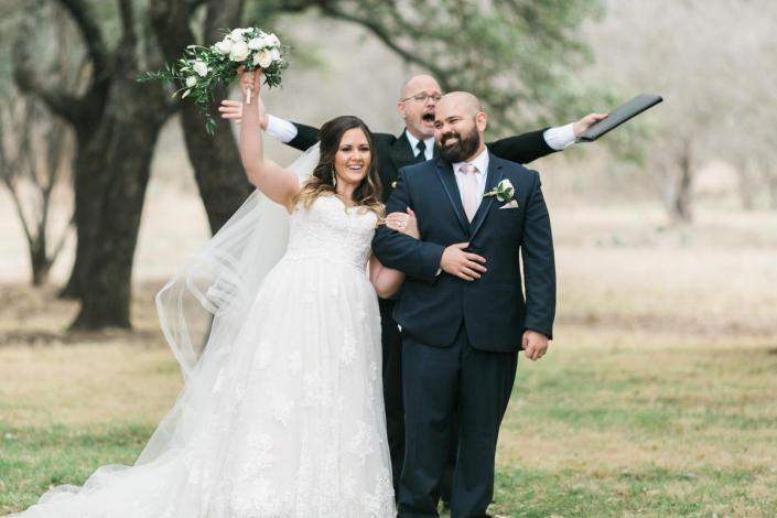 It's all cheers and smiles for these happy newlyweds! 